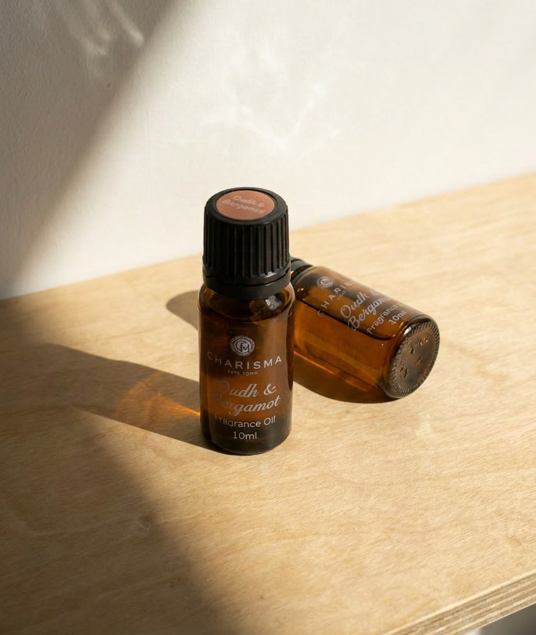 Charisma Candles Oudh & Bergamot fragrance oil bottle with a sleek design, showcasing the luxurious scent profile.