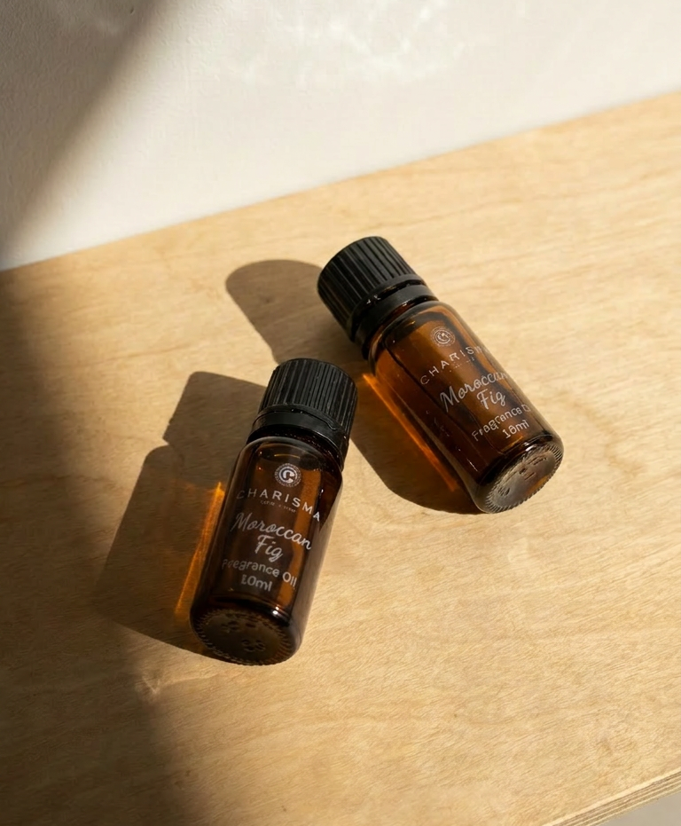 Charisma Candles Moroccan Fig fragrance oil in a clear glass bottle with a black cap, showing the product label and oil inside.