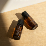 Charisma Candles Moroccan Fig fragrance oil in a clear glass bottle with a black cap, showing the product label and oil inside.