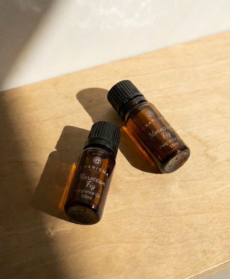 Charisma Candles Moroccan Fig fragrance oil in a clear glass bottle with a black cap, showing the product label and oil inside.
