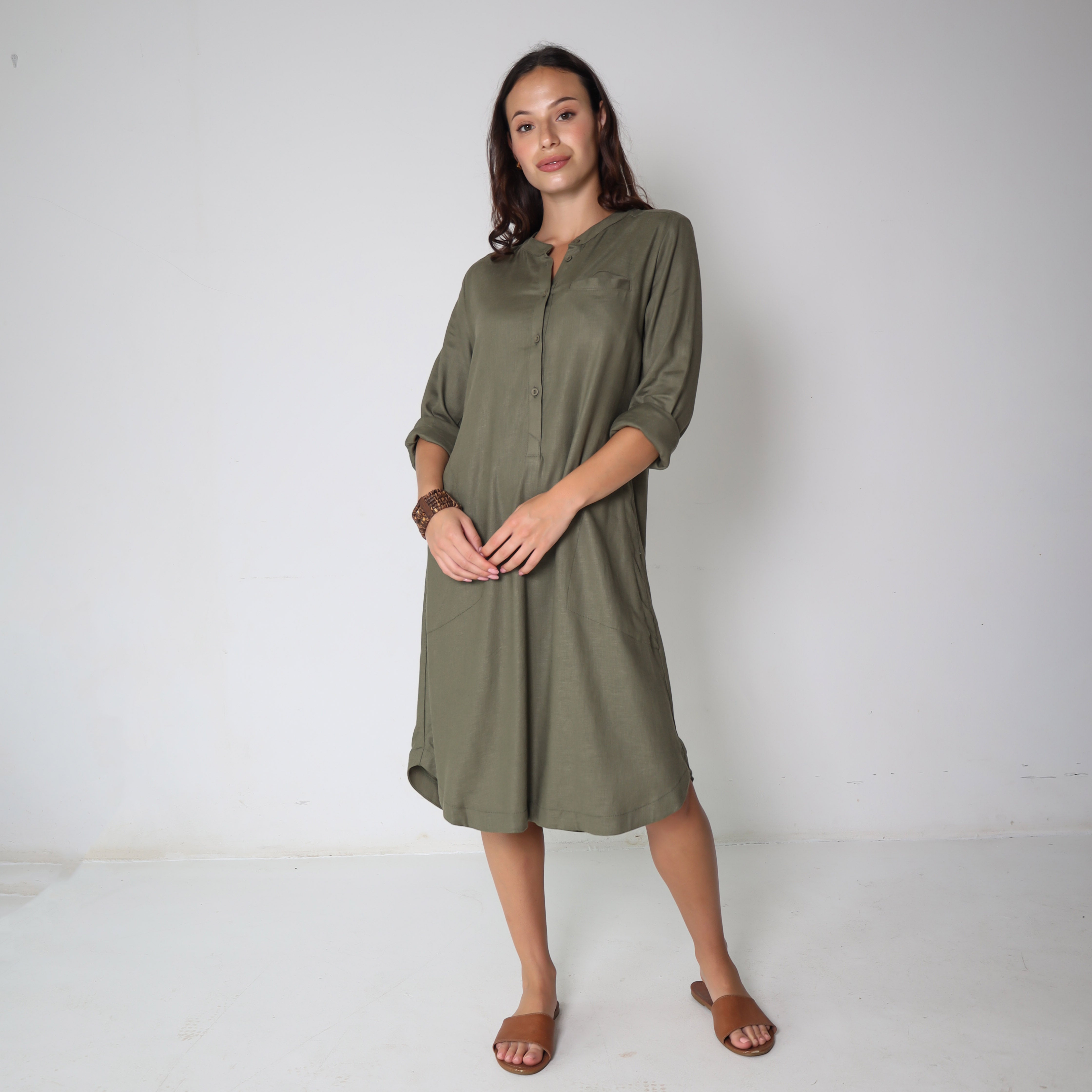 Shea green dress by Trinity, consignment, featuring a stylish, flowing design perfect for casual or semi-formal wear.
