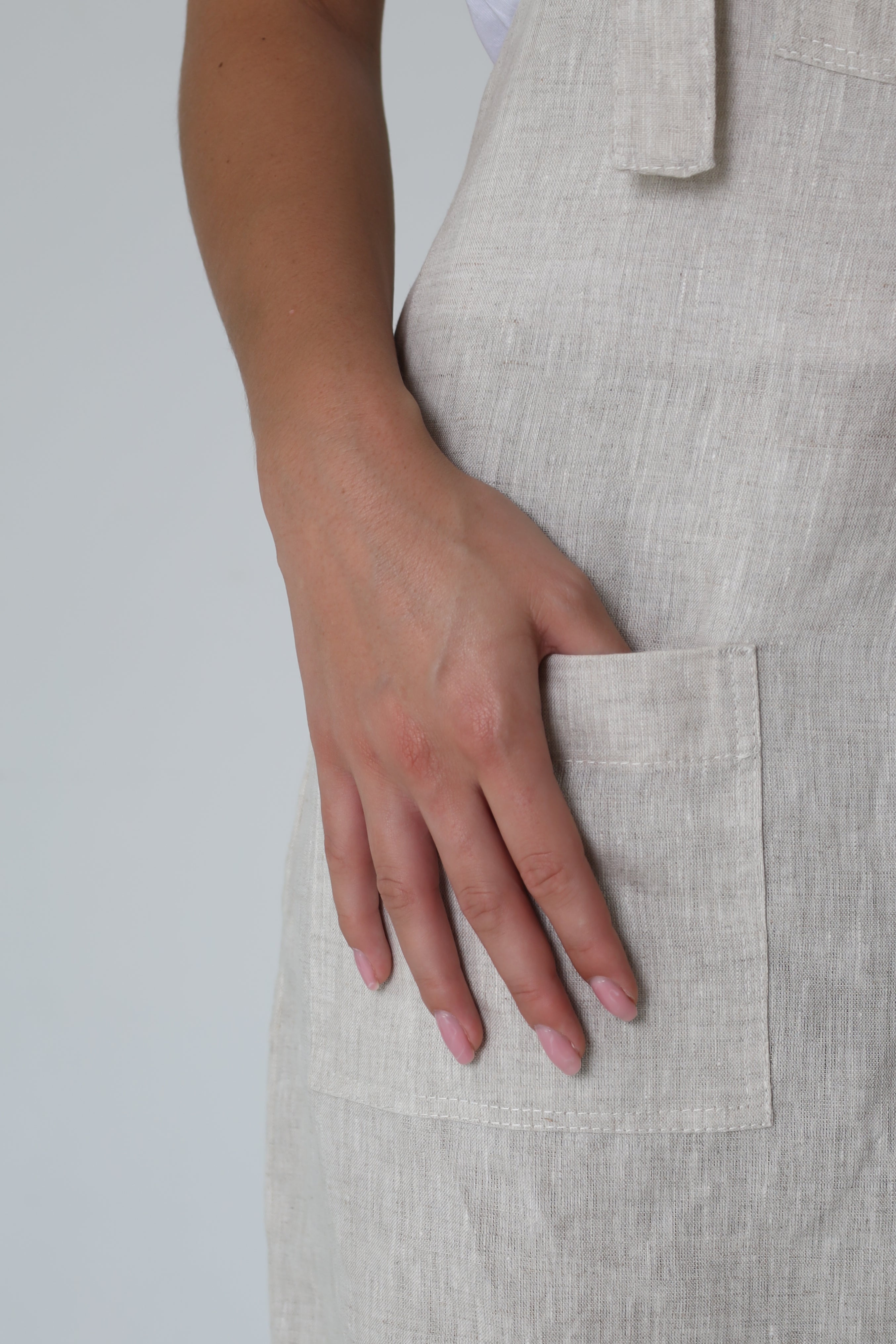 Di Ti Amo Clothing Nix Dungaree Long in natural color, made from comfortable fabric, displayed on a hanger.