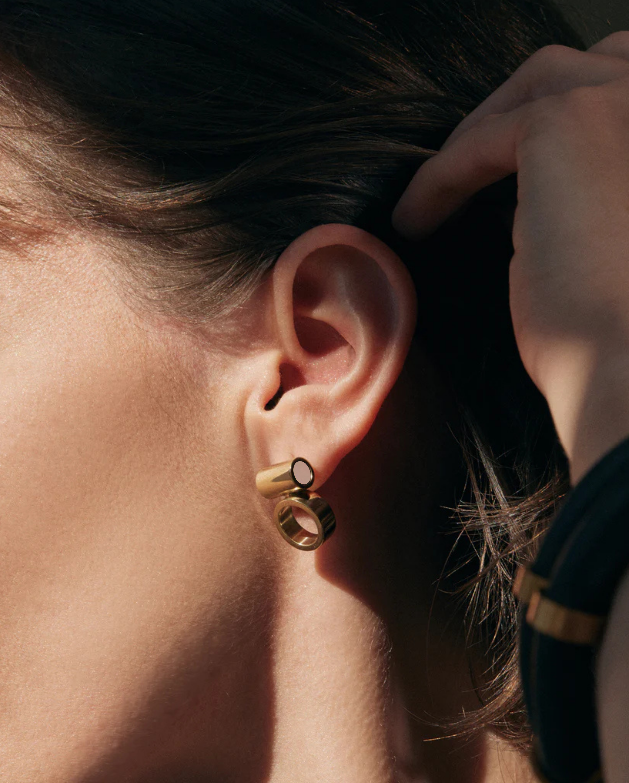 Iloni Designer Jewellery Horizon brass earring with stone, showcasing a sleek, modern design with intricate detailing and a polished finish.