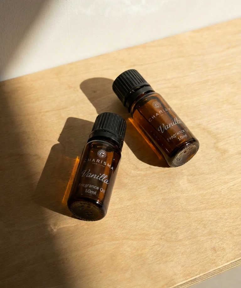 Charisma Candles vanilla fragrance oil in a clear glass bottle with a black cap, ready for use in aromatherapy or candle making.