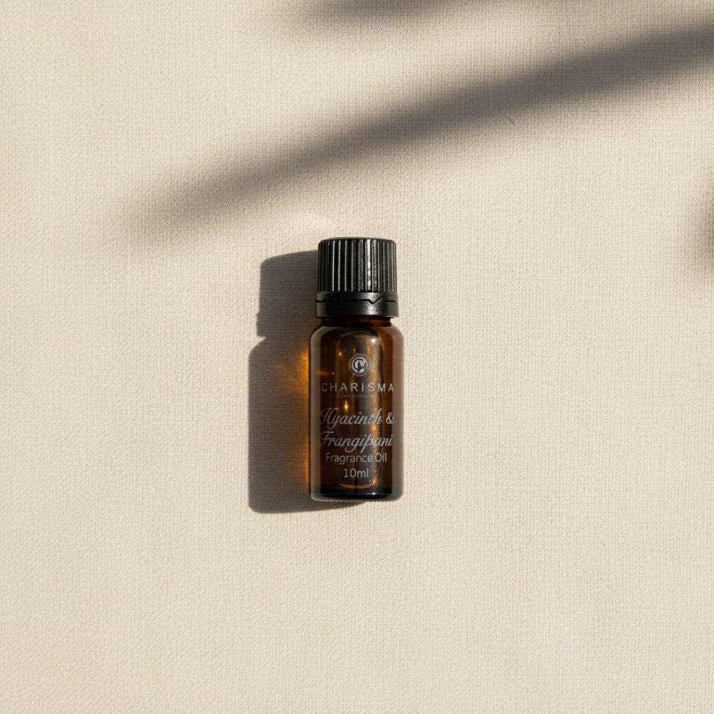 A small brown bottle labeled 'Charisma' with a dropper, containing 10ml of fragrance oil.