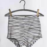 A black and white striped Brooks on the Line artwork by Adele Schmitz, featuring abstract line art on a white background.
