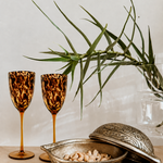 Tortoiseshell wine glass from Tusker Trading featuring a classic stemmed design and a tortoiseshell pattern.