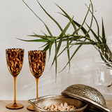 Tortoiseshell wine glass from Tusker Trading featuring a classic stemmed design and a tortoiseshell pattern.