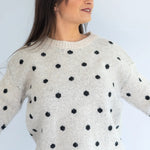 Grey Polka Knit Jersey by Coco & Salt, featuring a soft knit fabric with polka dot pattern, shown on a flat lay.