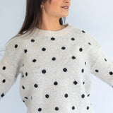 Grey Polka Knit Jersey by Coco & Salt, featuring a soft knit fabric with polka dot pattern, shown on a flat lay.