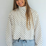 Coco & Salt Ella Jacket in Polka pattern, displayed on a hanger with close-up of fabric and design details.