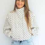 Coco & Salt Ella Jacket in polka dot pattern, stylish women's coat with button details, displayed on a hanger.