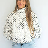 Coco & Salt Ella Jacket in polka dot pattern, stylish women's coat with button details, displayed on a hanger.