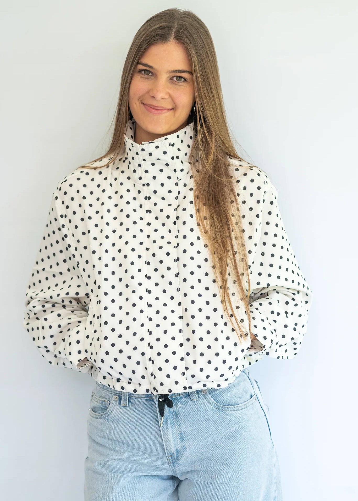 Coco & Salt Ella Jacket in polka dot pattern, stylish women's coat with button details, displayed on a hanger.