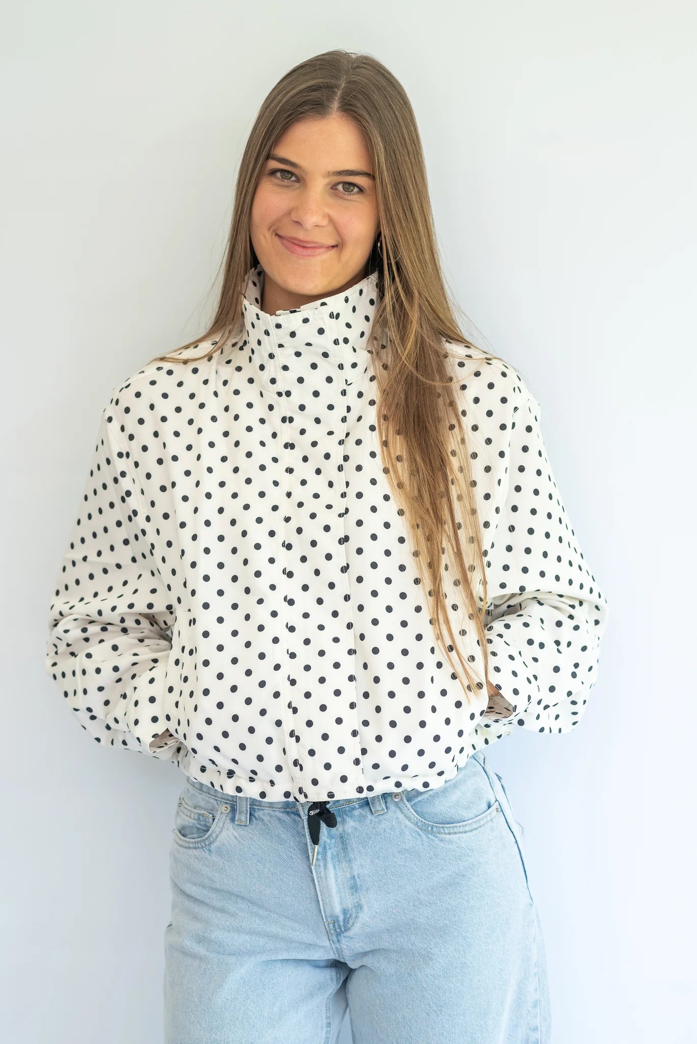 Coco & Salt Ella Jacket in polka dot pattern, stylish women's coat with button details, displayed on a hanger.