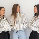 Coco & Salt Ella Jacket in Polka pattern, displayed on a hanger with a close-up view of the fabric and design details.