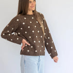 Polka Knit Jersey in Choc by Coco & Salt, displayed on a hanger with a soft knit texture and polka dot pattern.