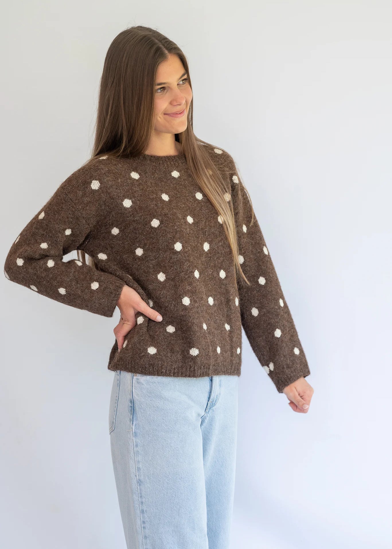 Polka Knit Jersey in Choc by Coco & Salt, displayed on a hanger with a soft knit texture and polka dot pattern.