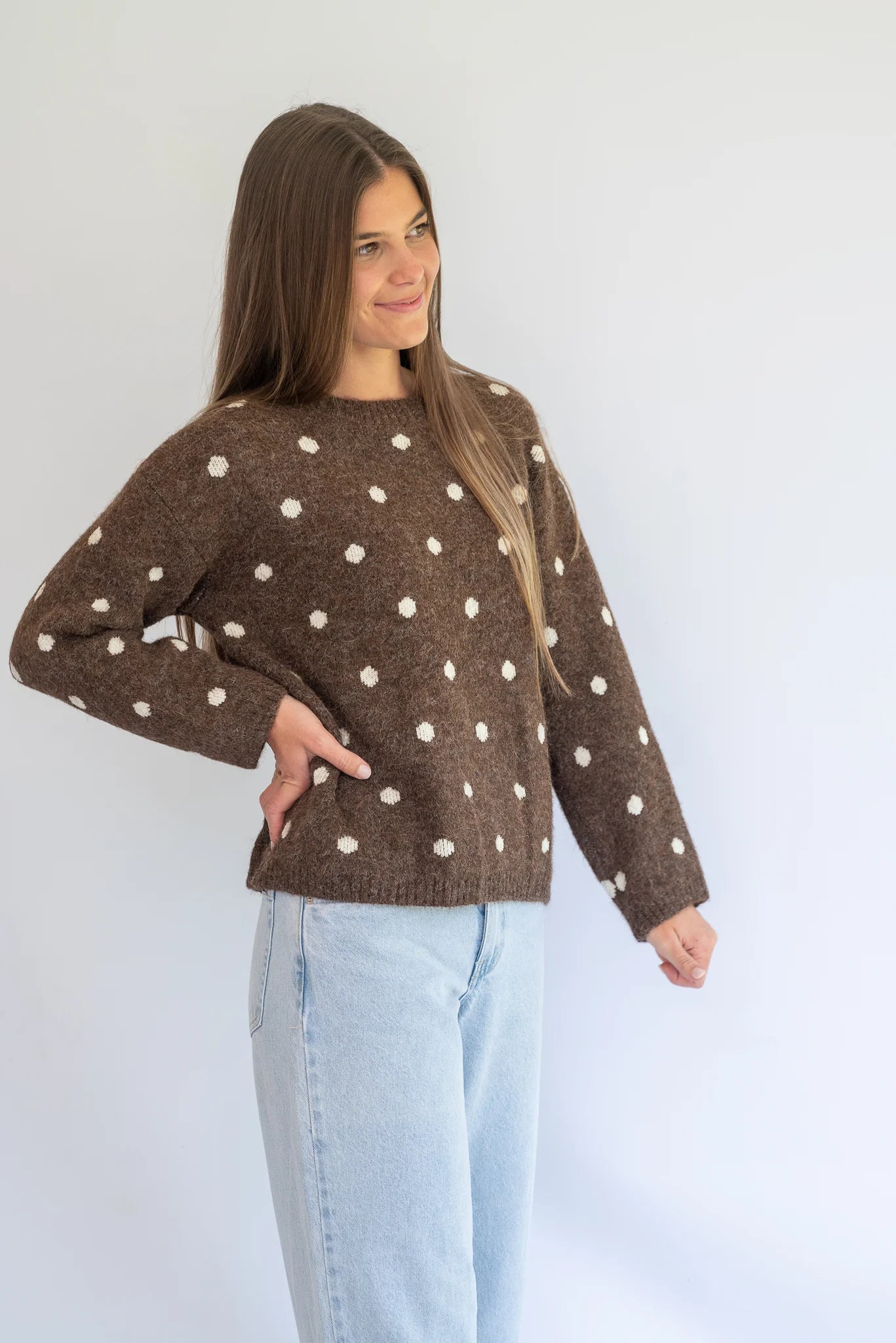 Polka Knit Jersey in Choc by Coco & Salt, displayed on a hanger with a soft knit texture and polka dot pattern.