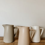 Raw clay milk jug by Pret-A-Pot, handcrafted ceramic cod-shaped pitcher for milk or liquids, with a rustic, artisanal finish.