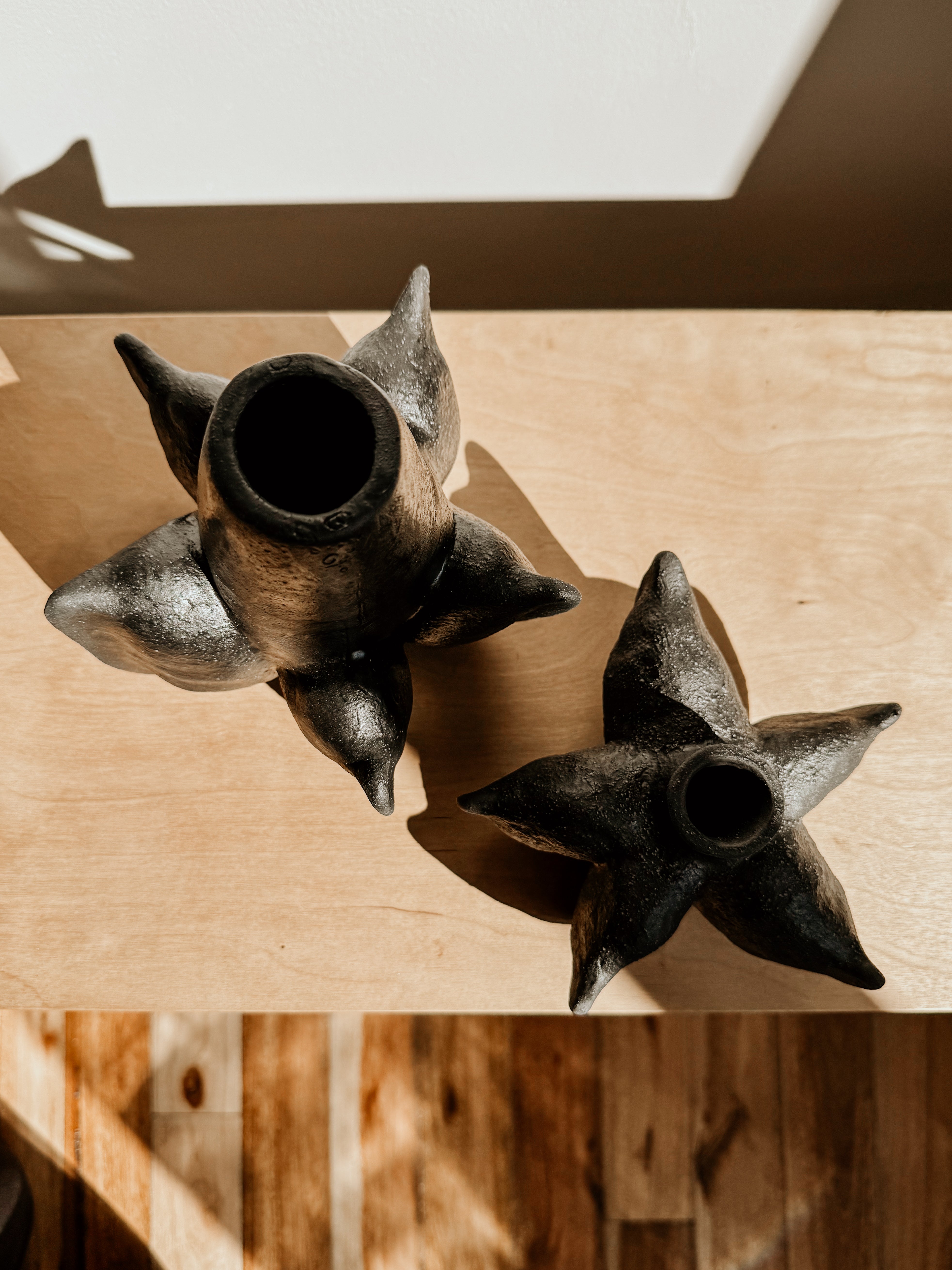Black Anise Vessel by Delphine, a stylish ceramic decor piece with a sleek, minimalist design on a neutral background.