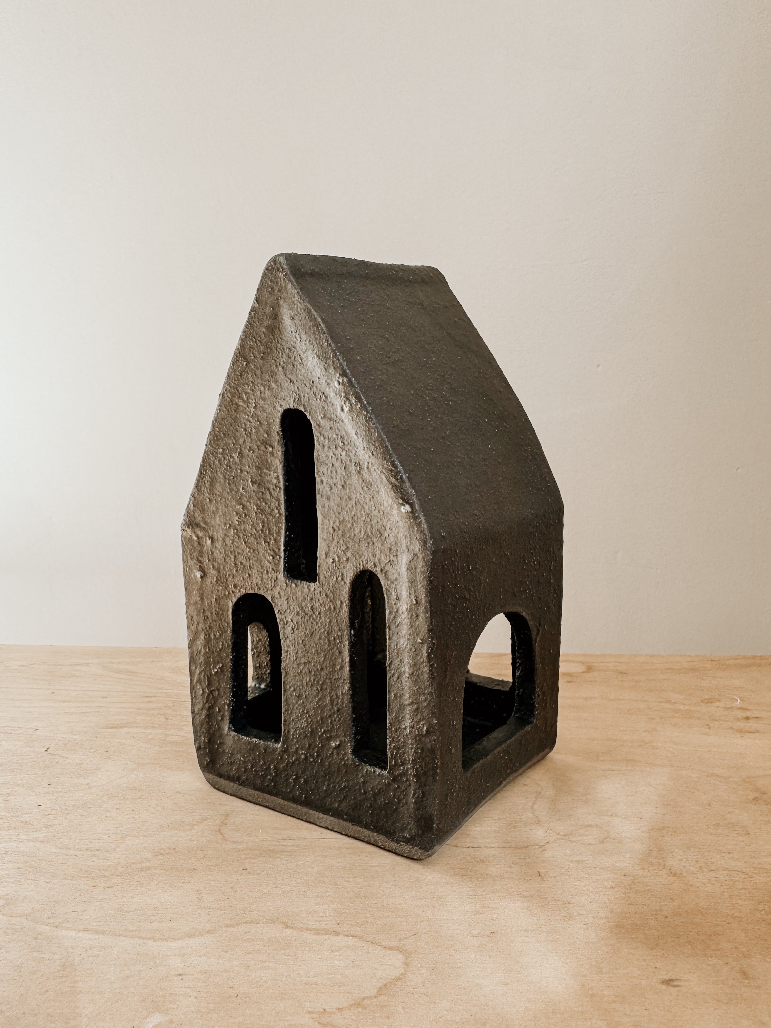 Large black Tea Light House by Delphine, decorative candle holder with a house design, ideal for cozy home decor.