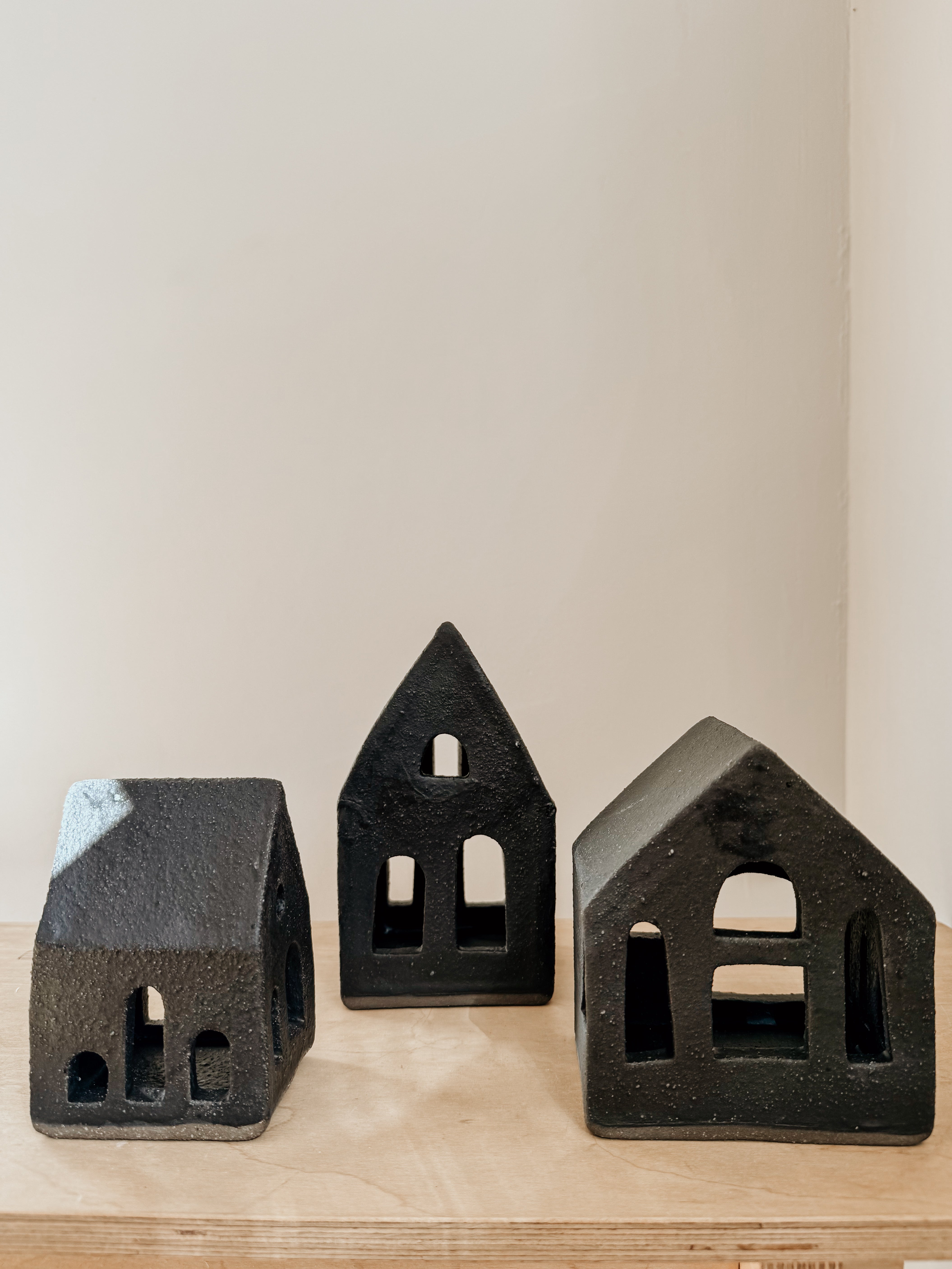 Large black Tea Light House by Delphine, decorative candle holder with intricate house design for cozy ambiance.