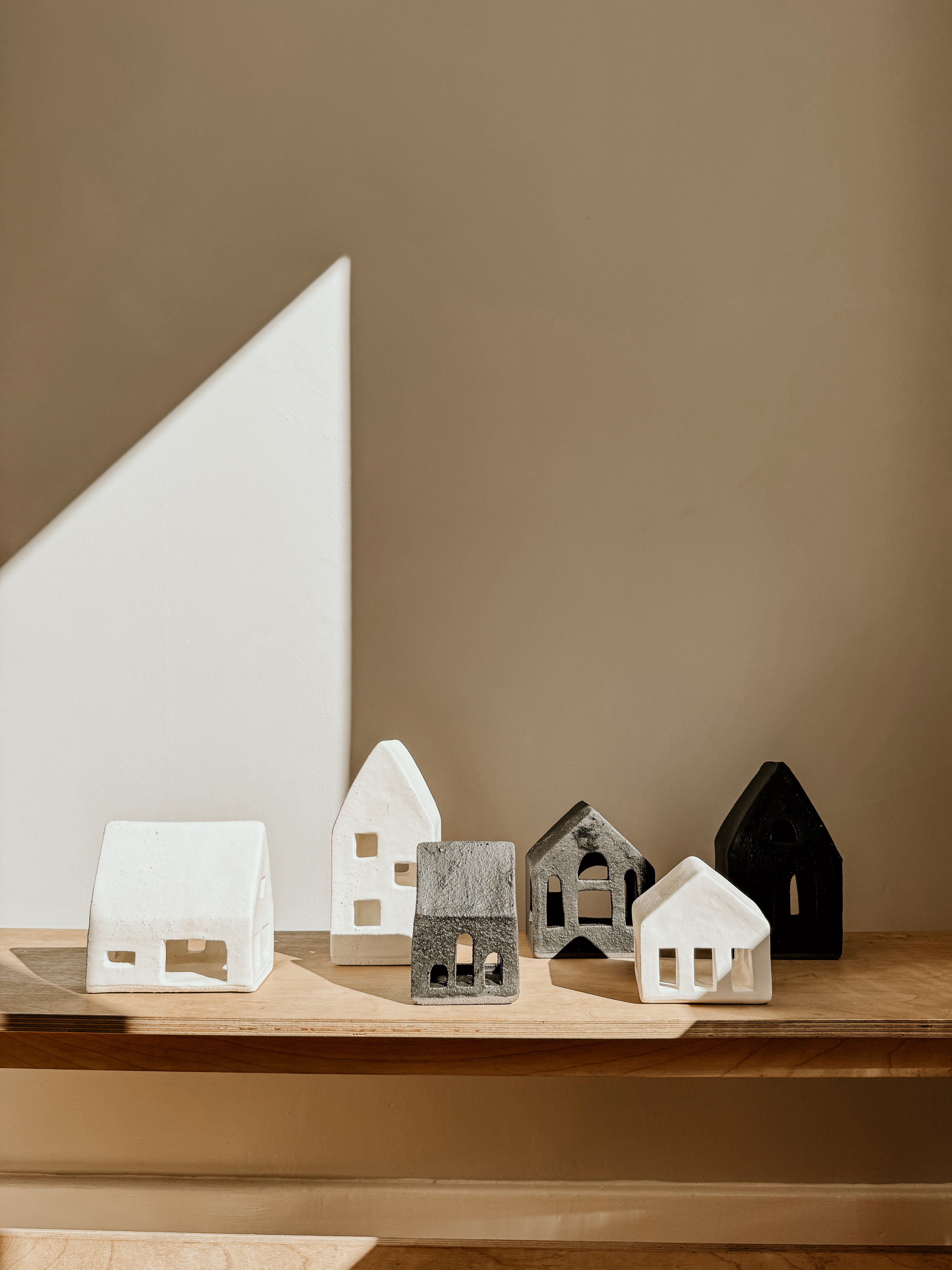 Large black Tea Light House by Delphine, decorative candle holder with a detailed house design, perfect for cozy ambiance.