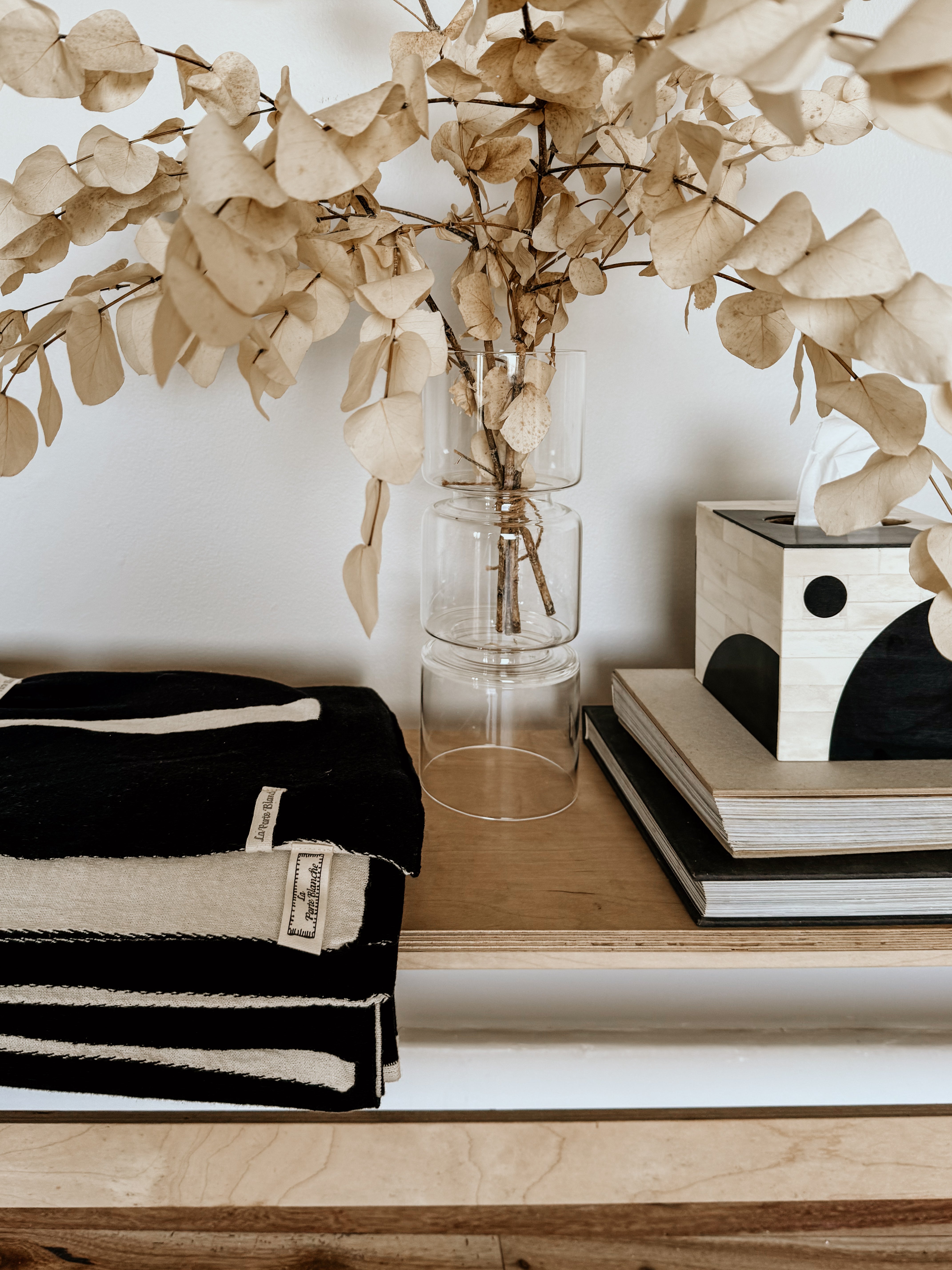 Black and white linear monochrome throw blanket by Homestyle Textiles CC, showcasing its modern design and soft fabric texture.