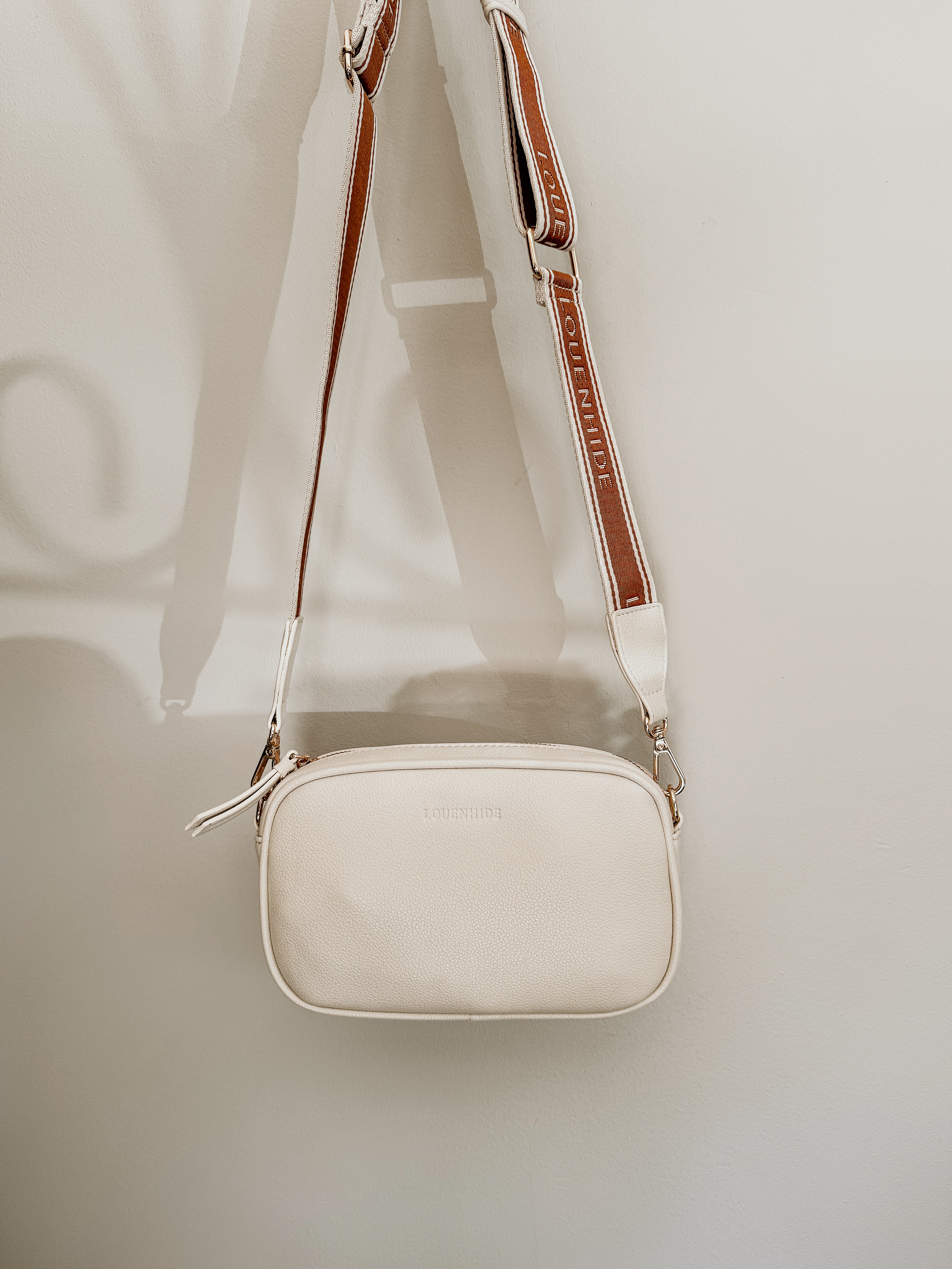 LouenHide Bianca Crossbody Bag in vanilla leather, stylish and compact with adjustable strap, perfect for everyday use.
