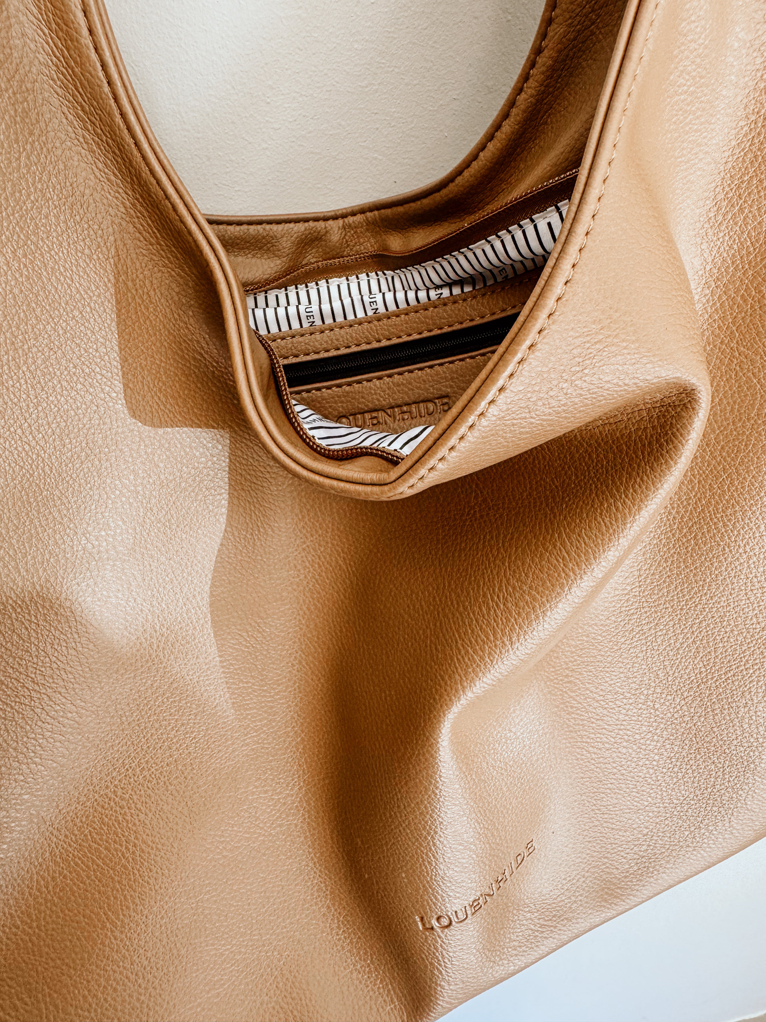 LouenHide Monaco shoulder bag in mocha color, stylish and compact for everyday use, shown in a consignment image.