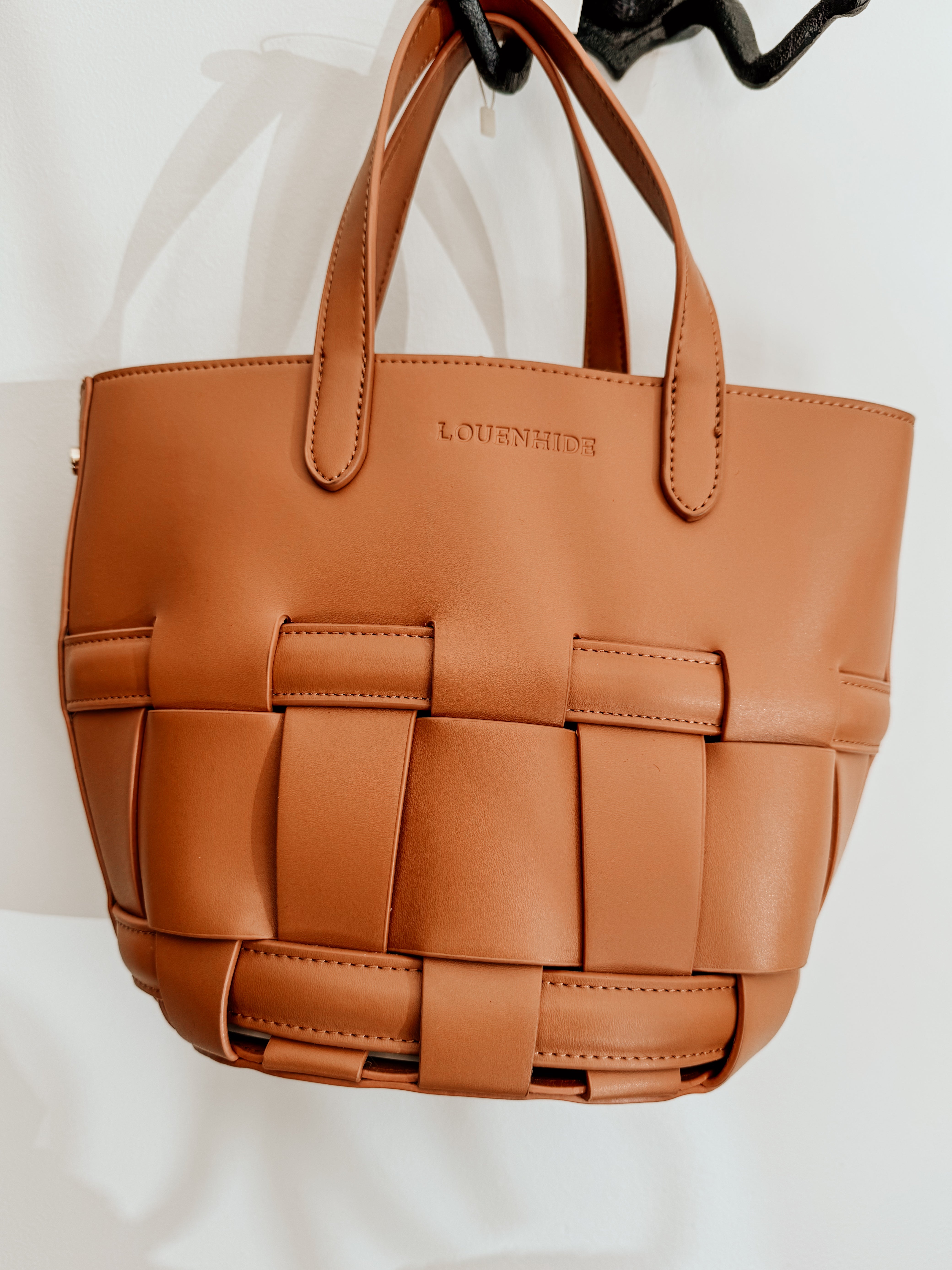 LouenHide Bettina Bucket Bag in tan leather with adjustable strap and spacious interior, stylish for everyday use.