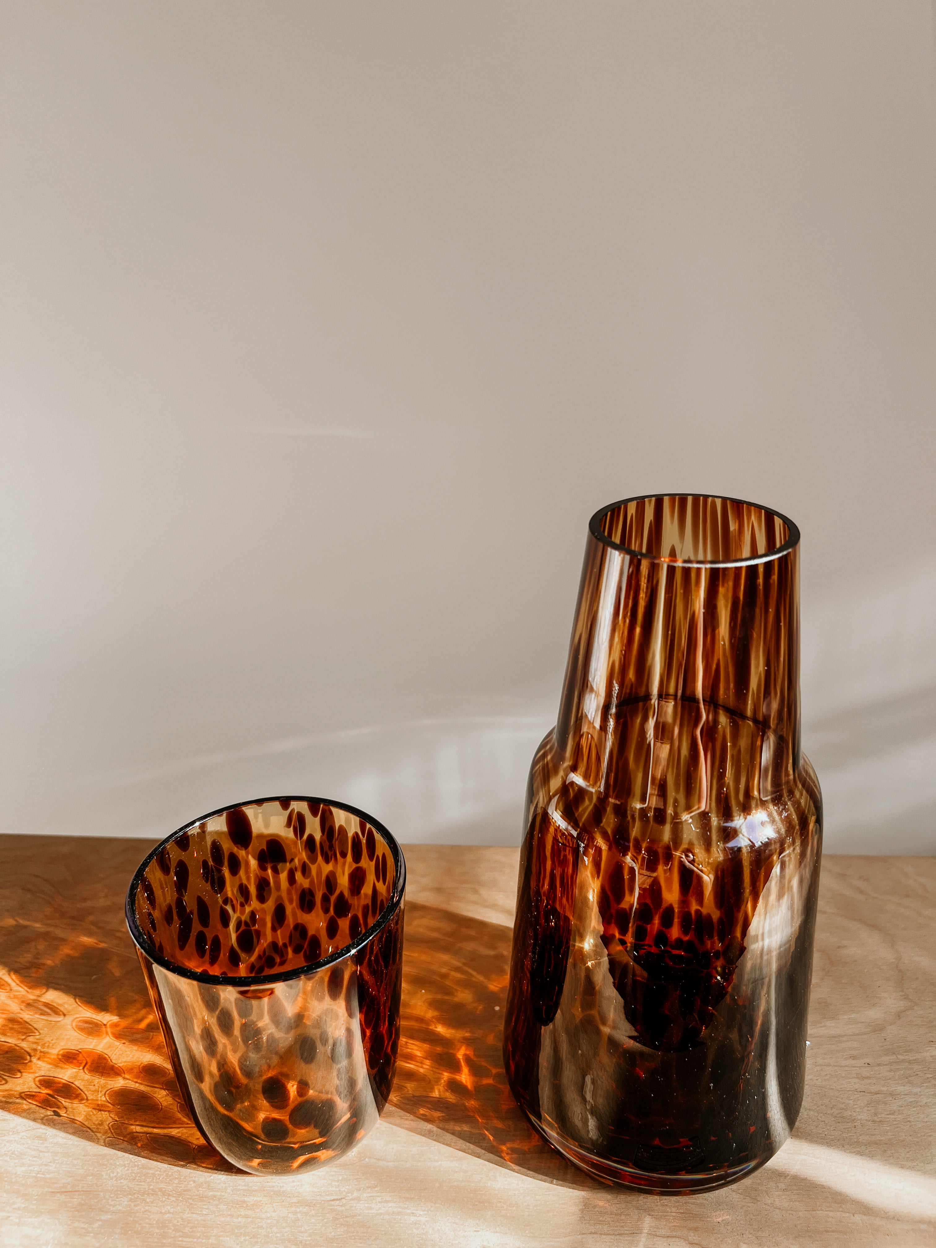 Tortoise shell Carrafe account from Tusker Trading, featuring a stylish tortoise shell design with a sleek, polished finish.