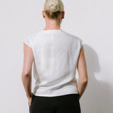 White Drape High Neck Top by Lika Designs, shown on a mannequin, featuring elegant fabric and stylish high neckline.