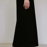 Black linen blend midi dress by Lika Designs, displayed on a mannequin with a relaxed fit and stylish design.