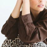 Trinity Page Shirt in chocolate with buttoned cuffs and bubble hem, collared blouse made in South Africa, stylish winter fashion.