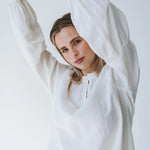 Trinity Denny reversible long sleeve shirt in white with balloon sleeves, made from natural fabric, stylish consignment apparel.