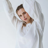 Trinity Denny reversible long sleeve shirt in white with balloon sleeves, made from natural fabric, stylish consignment apparel.