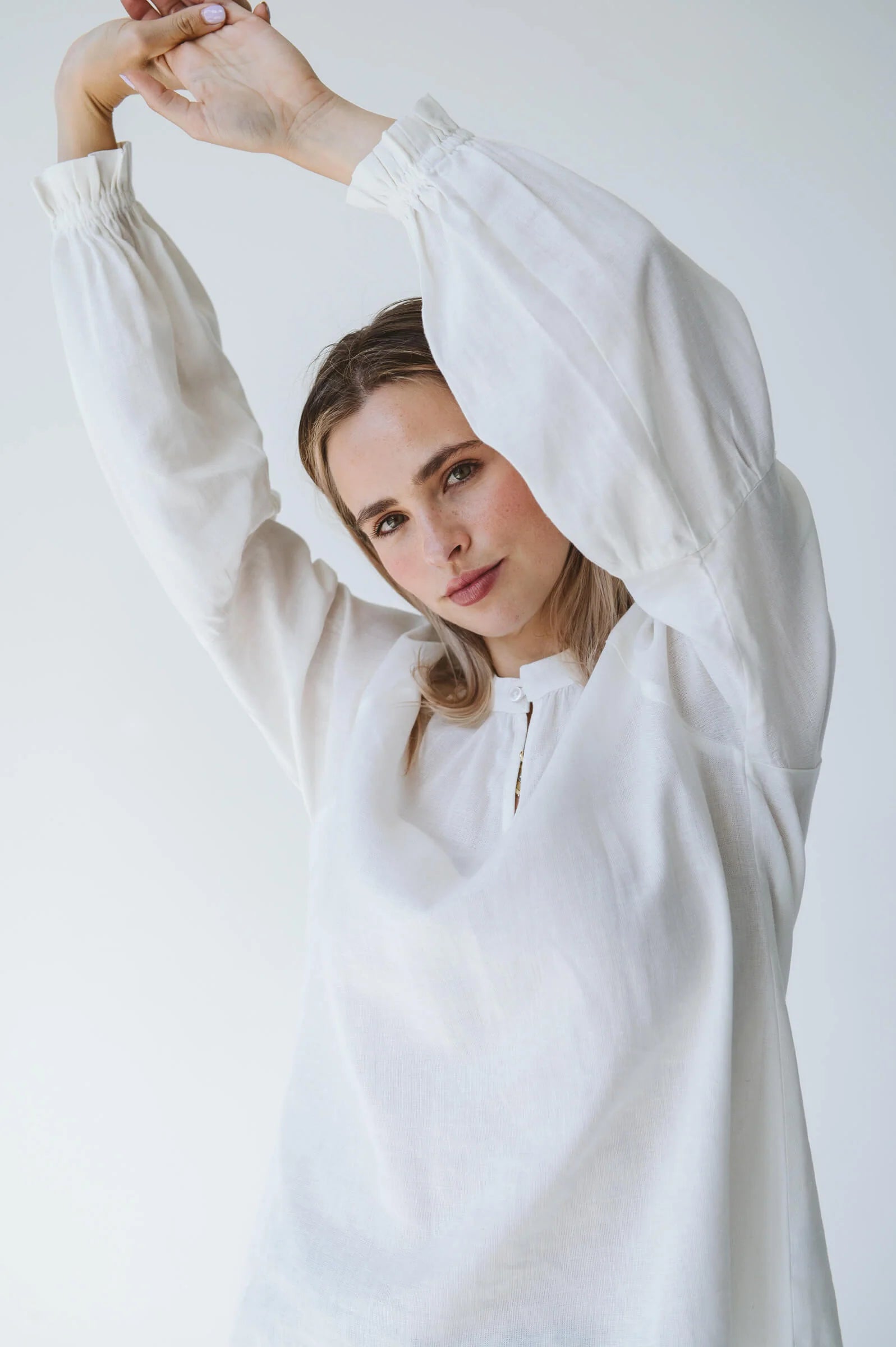 Trinity Denny reversible long sleeve shirt in white with balloon sleeves, made from natural fabric, stylish consignment apparel.