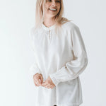 Trinity Denny reversible long sleeve shirt in white, made from natural fabric, shown flat with front and back views.