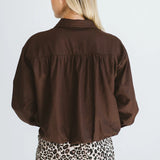 Trinity Page chocolate cotton long-sleeve collared shirt with pocket, from the Winter Collection 2026, made in South Africa.