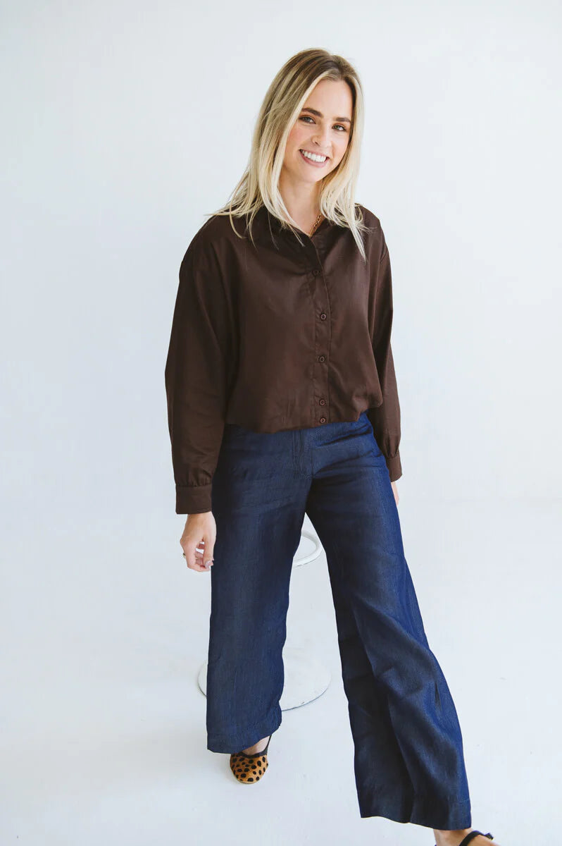 Trinity Page chocolate shirt from the Winter Collection, made in South Africa, featuring long sleeves, buttons, and a collar.