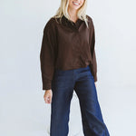 Trinity Page chocolate shirt from the Winter Collection, made in South Africa, featuring long sleeves, buttons, and a collar.