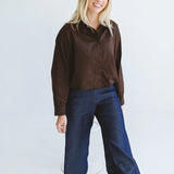 Trinity Page chocolate shirt from the Winter Collection, made in South Africa, featuring long sleeves, buttons, and a collar.