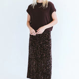 Chocolate sequins skirt by Trinity, made in South Africa, shown on a model from the Winter Collection 2026.