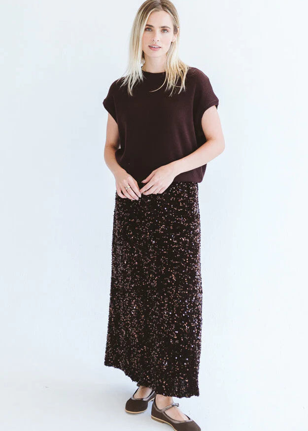 Chocolate sequins skirt by Trinity, made in South Africa, shown on a model from the Winter Collection 2026.