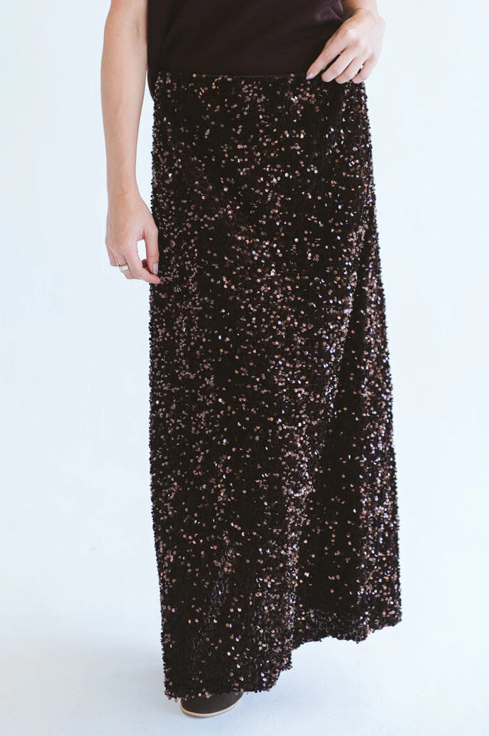 Close-up of Trinity chocolate sequins skirt from the Winter Collection, showcasing shiny, textured sequins on a stylish consignment piece.