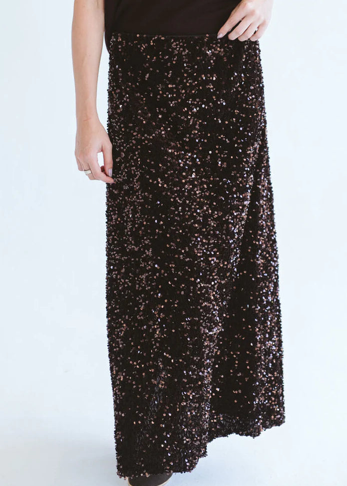 Close-up of Trinity chocolate sequins skirt from the Winter Collection, showcasing shiny, textured sequins on a stylish consignment piece.
