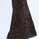 Close-up of Trinity chocolate sequins skirt from the Winter Collection, showcasing shiny embellishments and elegant design.