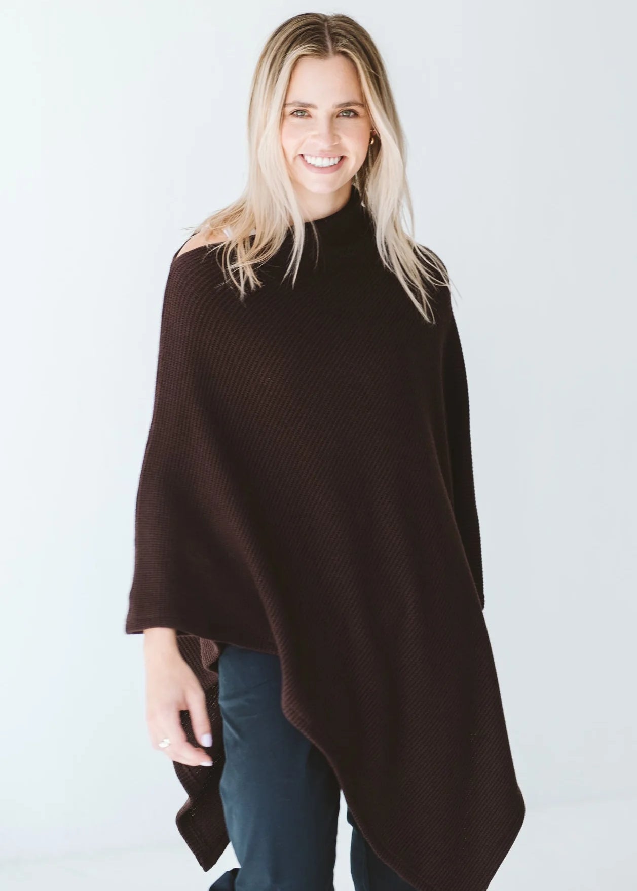 Trinity chocolate poncho made in South Africa, cozy and stylish outerwear accessory for cold weather, comfortable winter fashion.